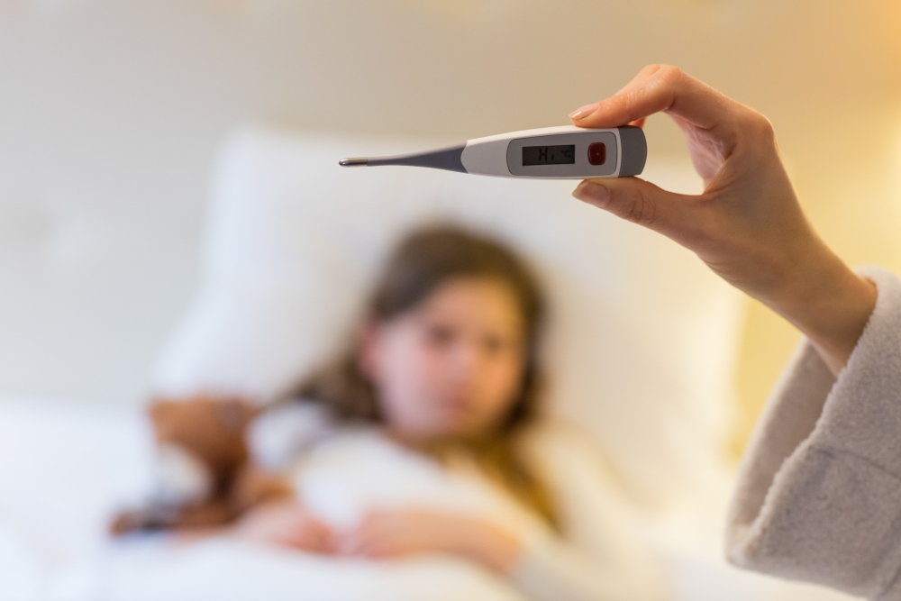 mother cheking fever--Drug Resistant Salmonella Outbreak